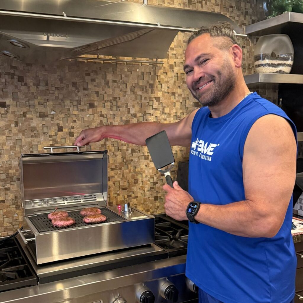 Johnny Damon grilling burgers on Kenyon electric grill