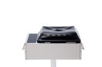 back view of Stainless steel built-in electric grill with a black lid and touch controls, mounted on a post against a black background.