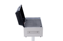 side view of Stainless steel built-in electric grill with a black lid and touch controls, mounted on a post against a black background.
